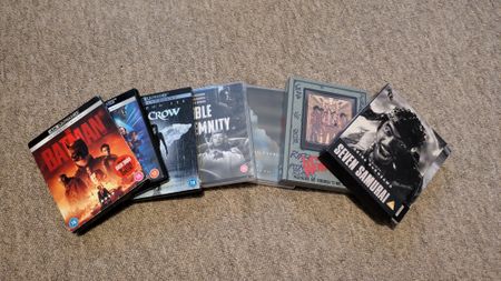 Image of various 4K Blu-rays on floor