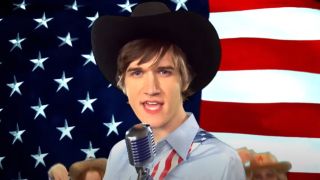 Bo Burnham as country singer Chipp standing in front of American flag on Parks and Recreation.