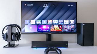 The Arzopa M3RC gaming monitor on a desk with an Xbox Series X, soundbar and a headphone stand