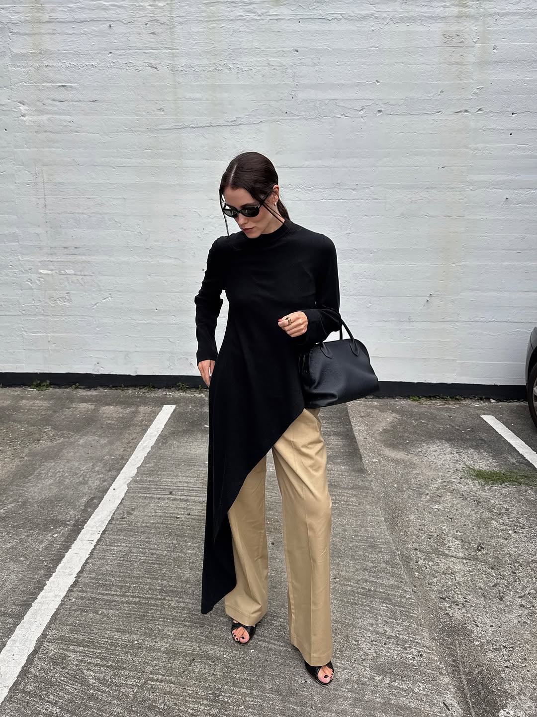 woman wearing dress over pants fall outfit 2025