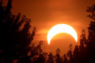 Photographer Elon Gane snapped this photo on May 20, during the annular solar eclipse, from El Dorado Springs, Mo. "We had pretty good visibility here, some clouds did block some of it at first, but as the eclipse progressed they were not a problem," Gane