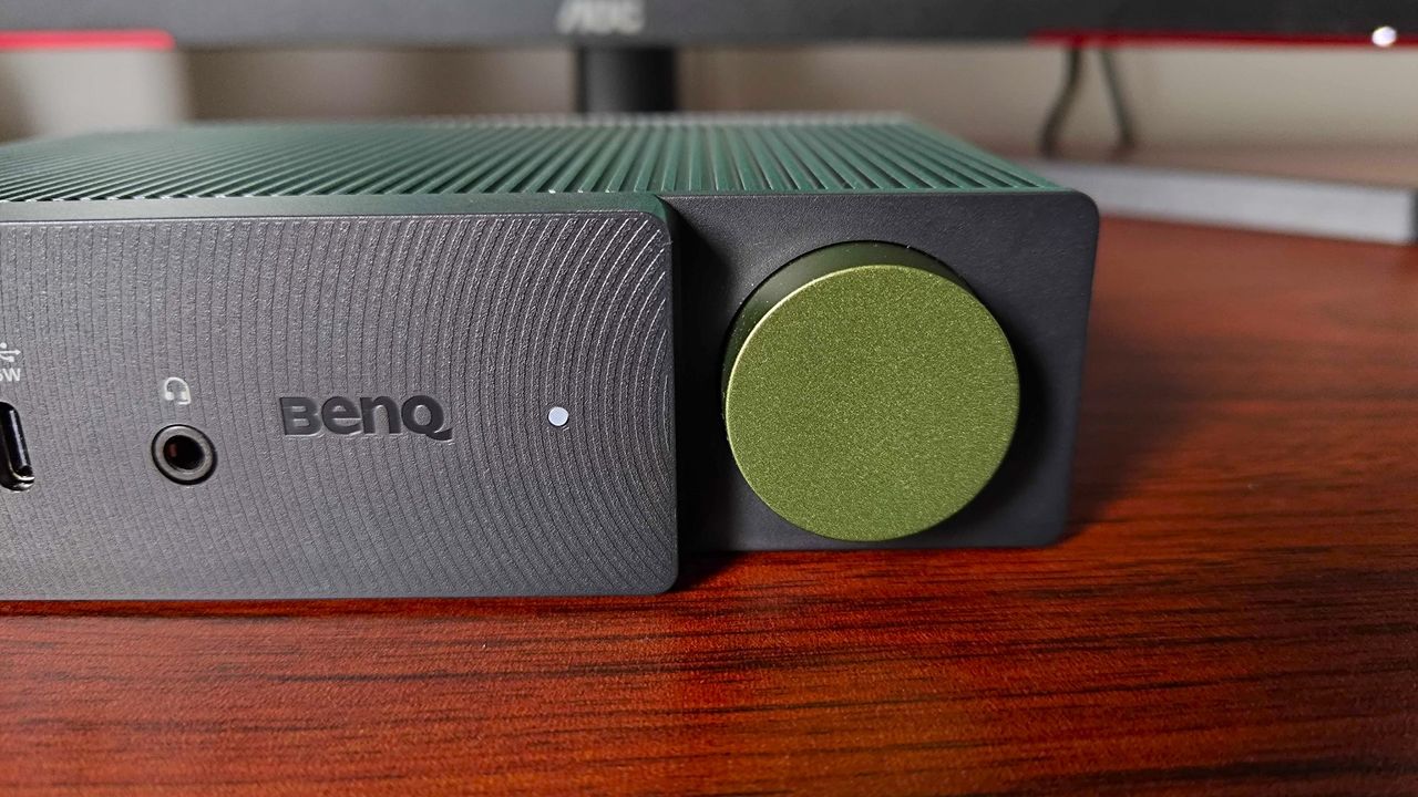 Closeup of BenQ BeCreatus green button sitting on desk