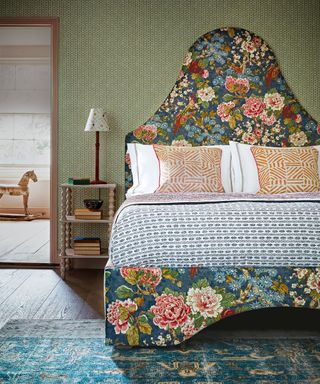 Romantic bedroom with floral headboard and bed frame