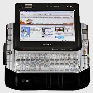 Sony's VAIO UX180P docked in its port replicator with the keyboard open.