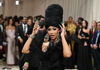 Cardi B wearing a very thick triangular manicure to the 2024 Met Gala.