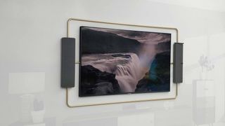 TCL's high-end TVs use jutting metal bars to attach speakers to the wall mount (Image Credit: TechRadar)