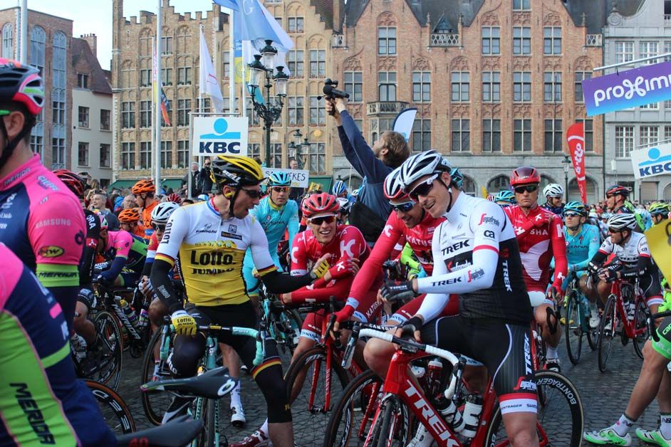 Riders laugh and joke with each other on the start line