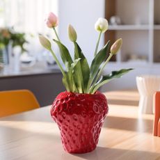 Strawberry vase on kitchen table