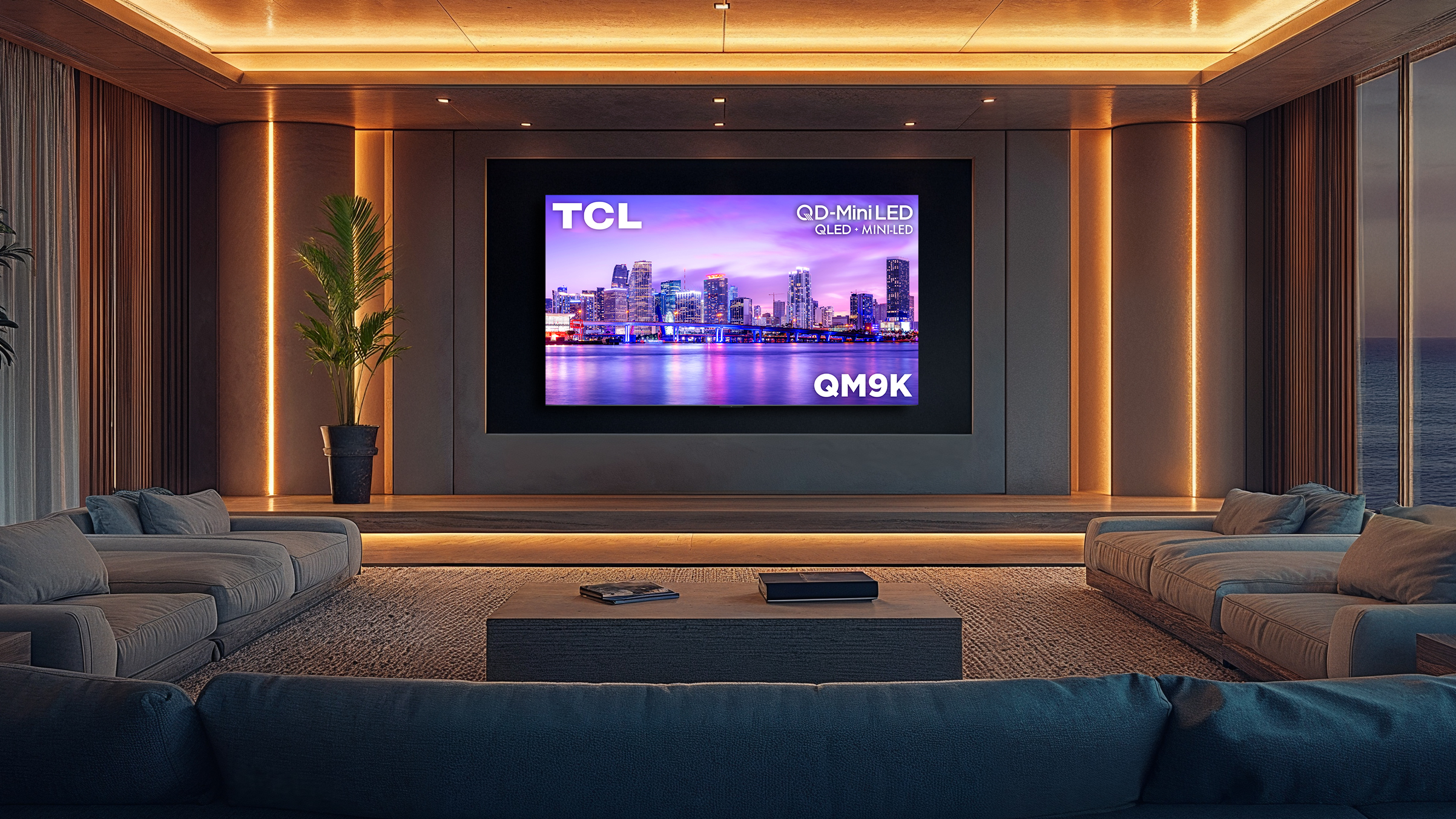 TCL QM9K TV shown in home theater setting with table and sofas