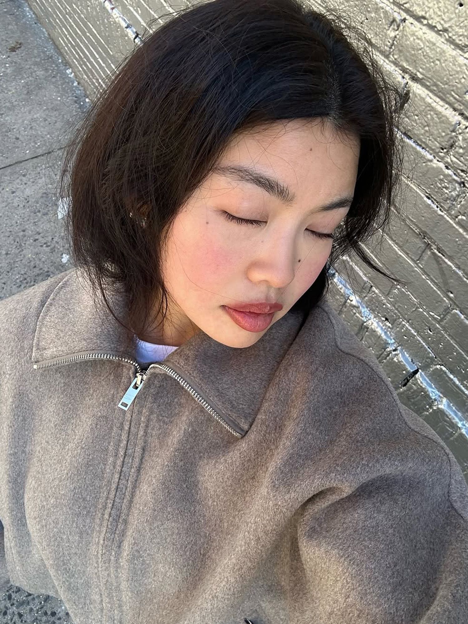 Allison Ho with glowing skin and full, mauve-toned lips