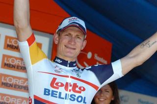 Andre Greipel (Lotto Belisol) salutes from the podium.