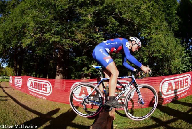 Jeremy Powers (Rapha Focus) bunny-hopping a log on the course