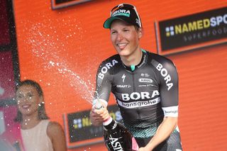 Lukas Postlberger (Bora-Hansgrohe) on the podium after winning the opening stage at the 2017 Giro d'Italia