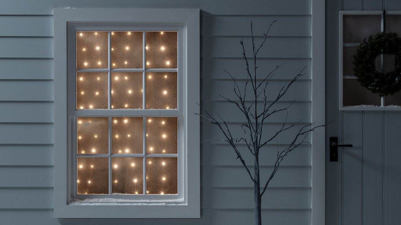 Warm white micro curtain light decoration on Christmas window