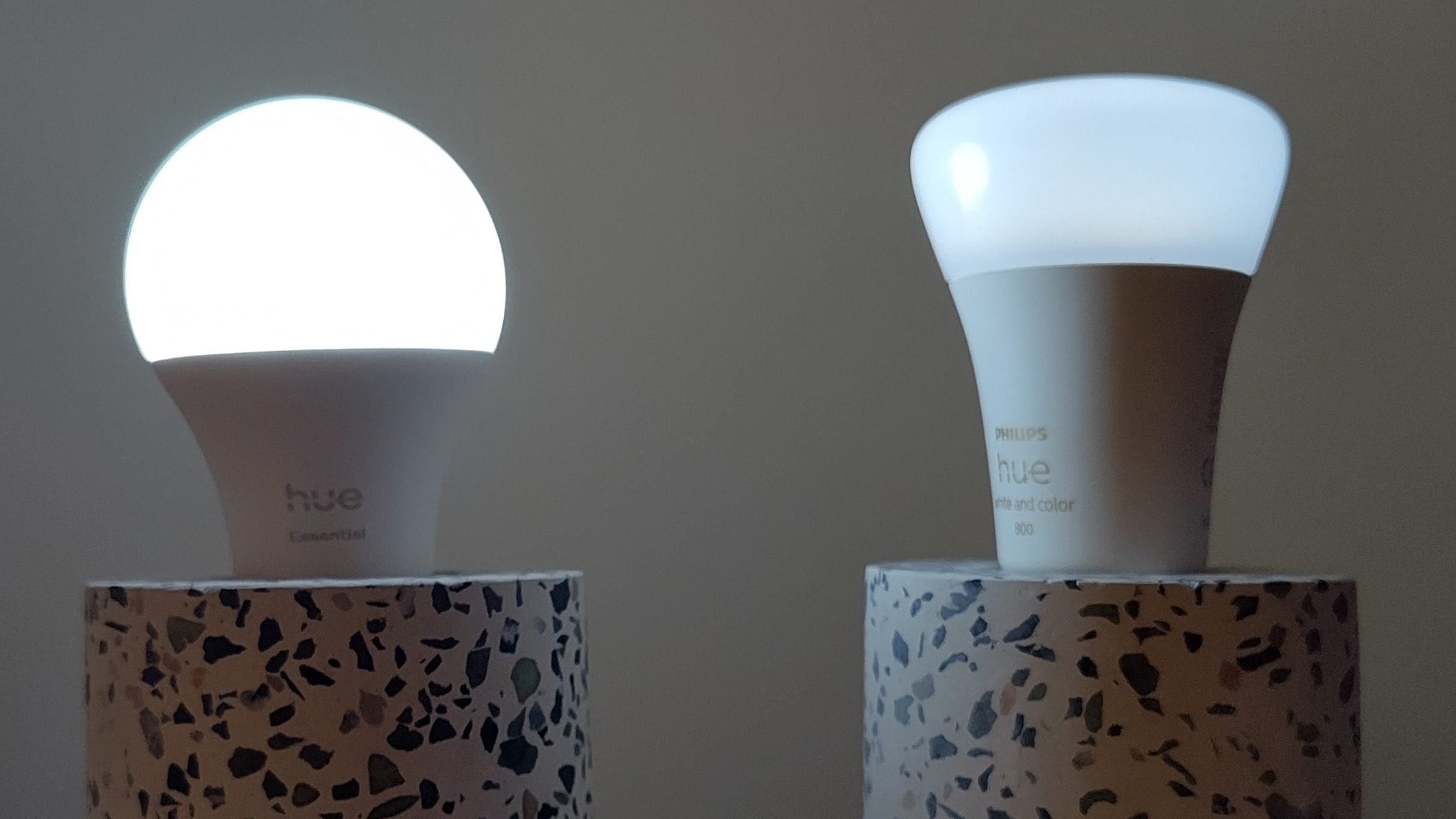 Philips Hue Essential bulb and Philips Hue White &amp;amp; Color Ambiance bulbs in identical lamps on their dimmest settings