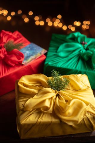 christmas presents wrapped in fabric