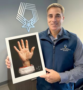 The sale of My Hand My Cause's portrait of former NASA astronaut Chris Cassidy's right hand will raise funds for the National Medal of Honor Museum Foundation.