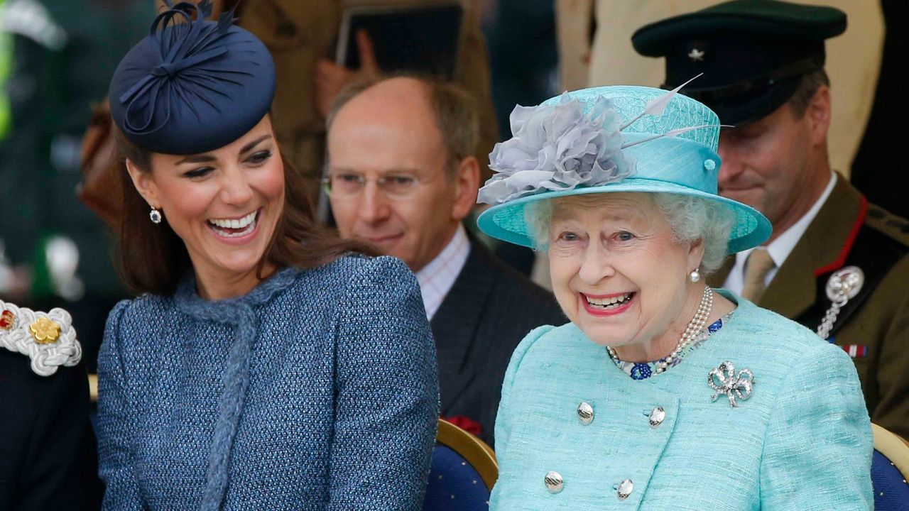 Catherine, Duchess of Cambridge and Queen Elizabeth II watch part of a children&#039;s sports event while visiting Vernon Park during a Diamond Jubilee visit to Nottingham on June 13, 2012