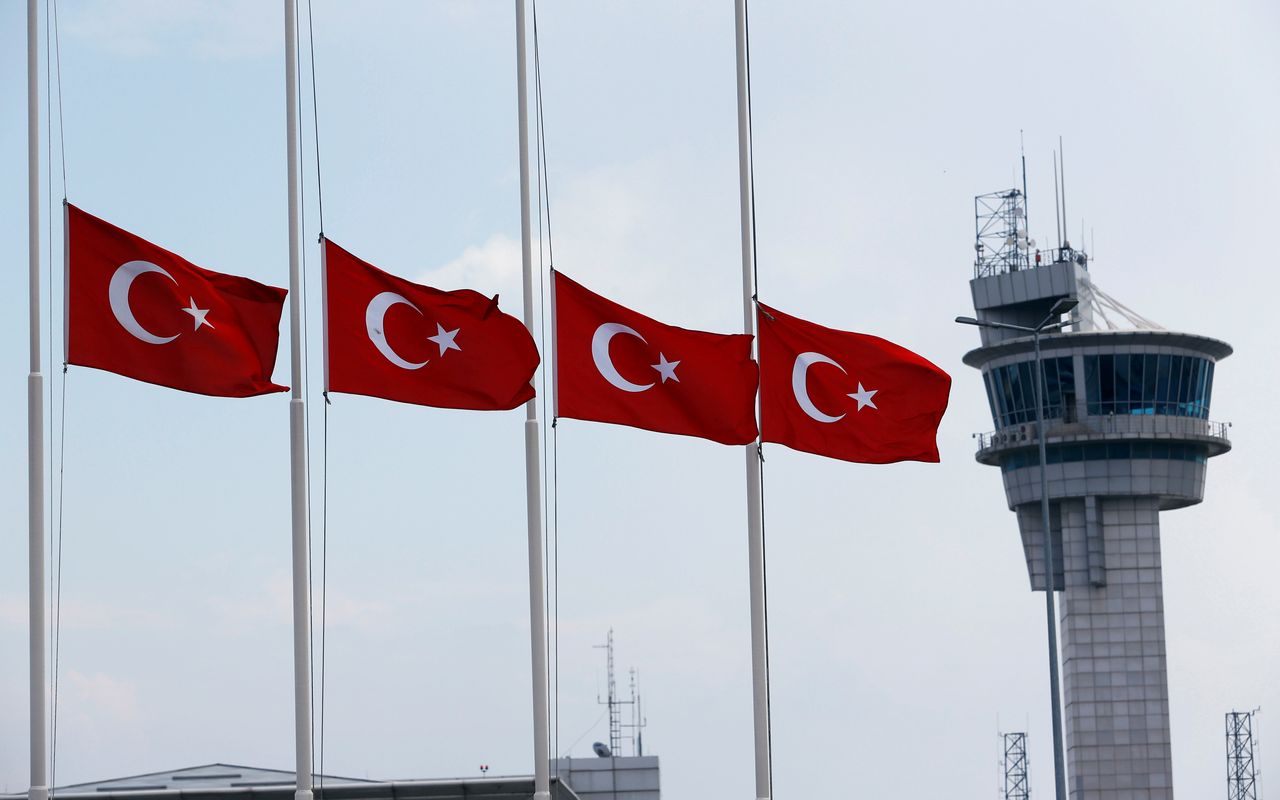 Turkish flags fly outside Ataturk Airport