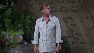 Roger Moore's James Bond looks confused as he stands in a giant room