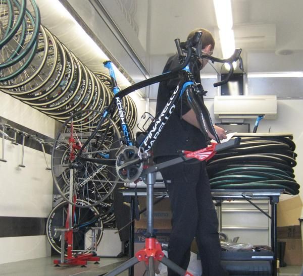 A team mechanic gets to work on the bikes ahead of Sunday's race