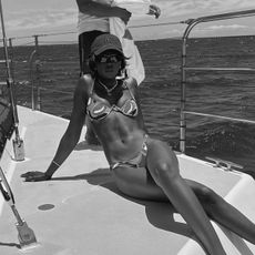 Amy Julliette Lefévre wearing a patterned underwire bikini on a boat. 
