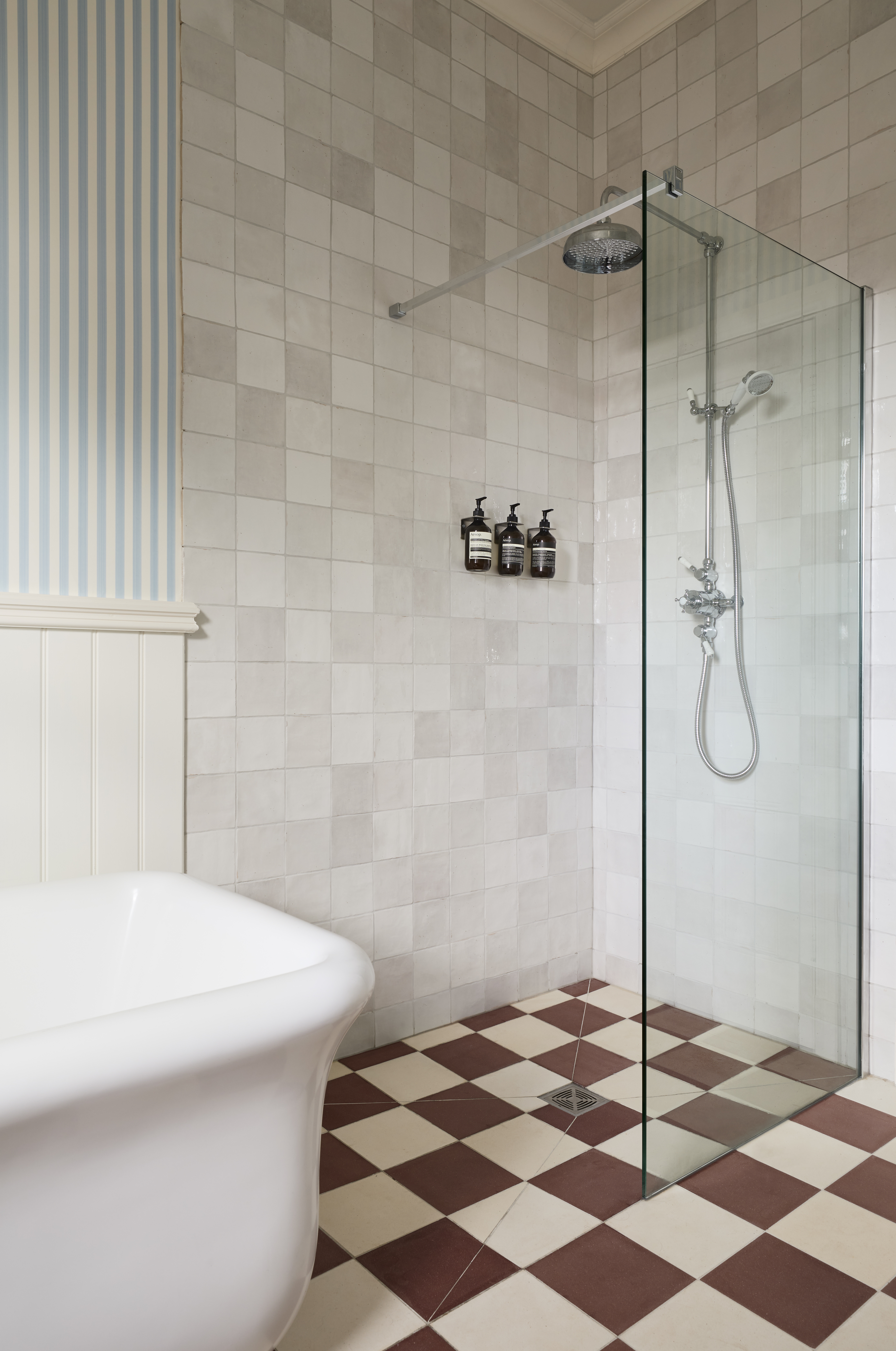 a bathroom renovation with a chequerboard floor