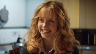 Sydney Sweeney, with big blonde hair and denim jacket, starring in Americana (2025).