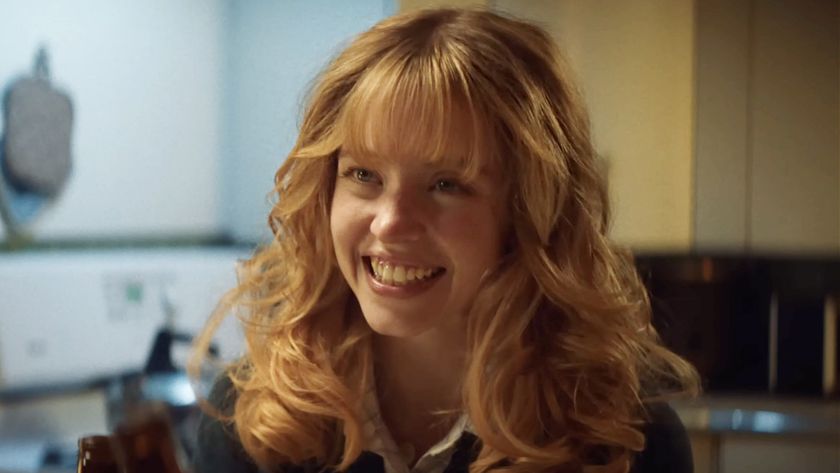 Sydney Sweeney, with big blonde hair and denim jacket, starring in Americana (2025).