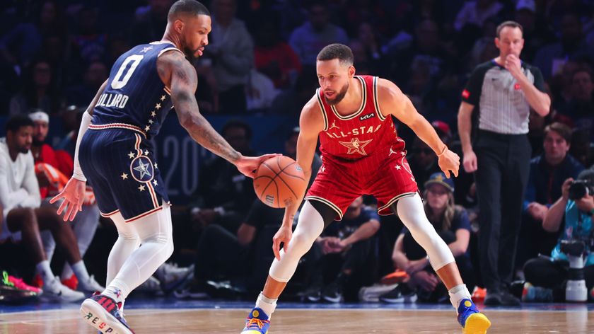 Damian Lillard #0 of the Milwaukee Bucks and Eastern Conference All-Stars dribbles the ball against Stephen Curry #30 of the Golden State Warriors and Western Conference All-Stars in the third quarter during the 2024 NBA All-Star Game