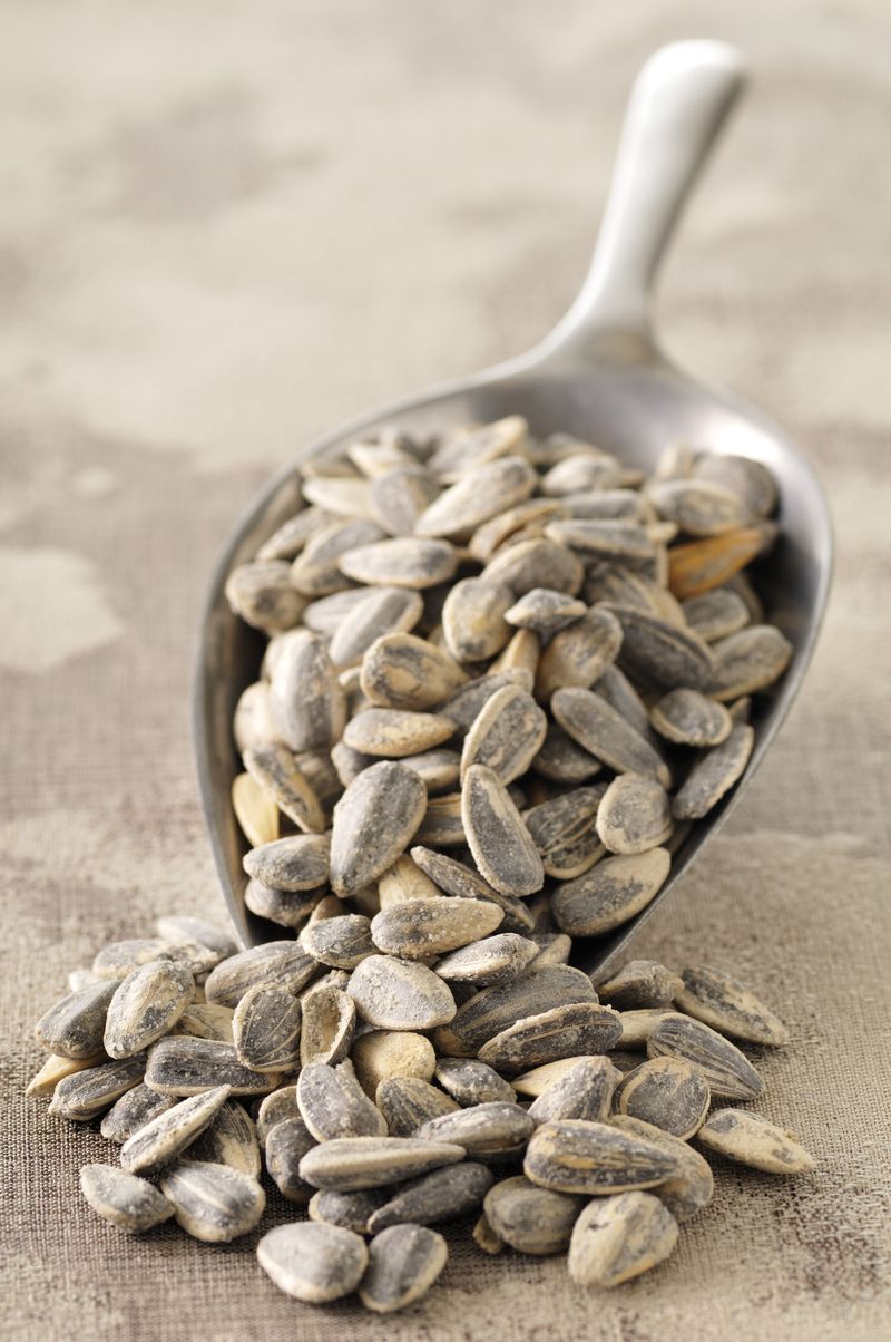 Ingredient, Seed, Natural material, Kitchen utensil, Produce, Close-up, Photography, Still life photography, Sunflower seed, Spoon,
