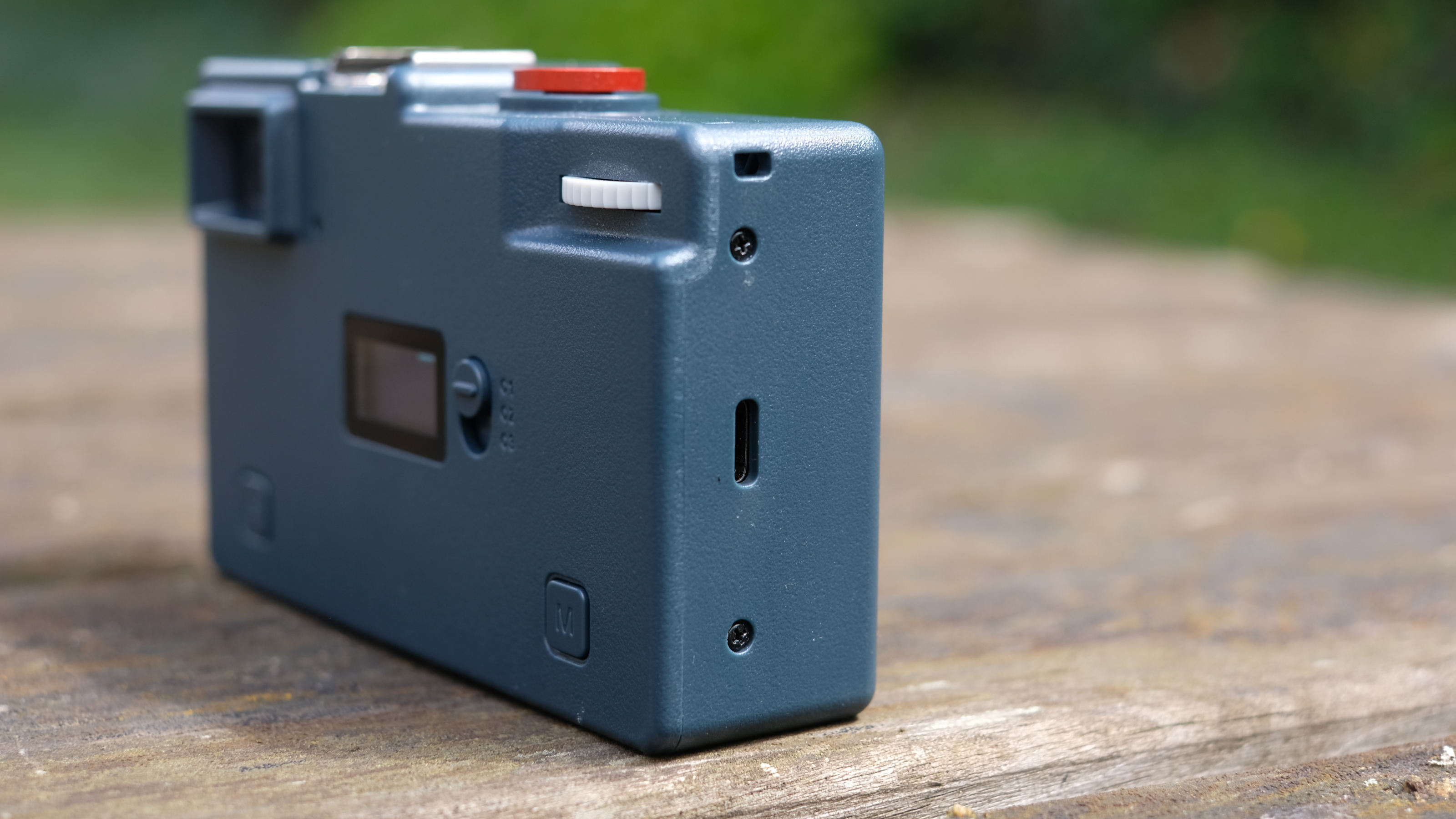 Photograph of RewindPix digital compact camera showing side with USB-C port