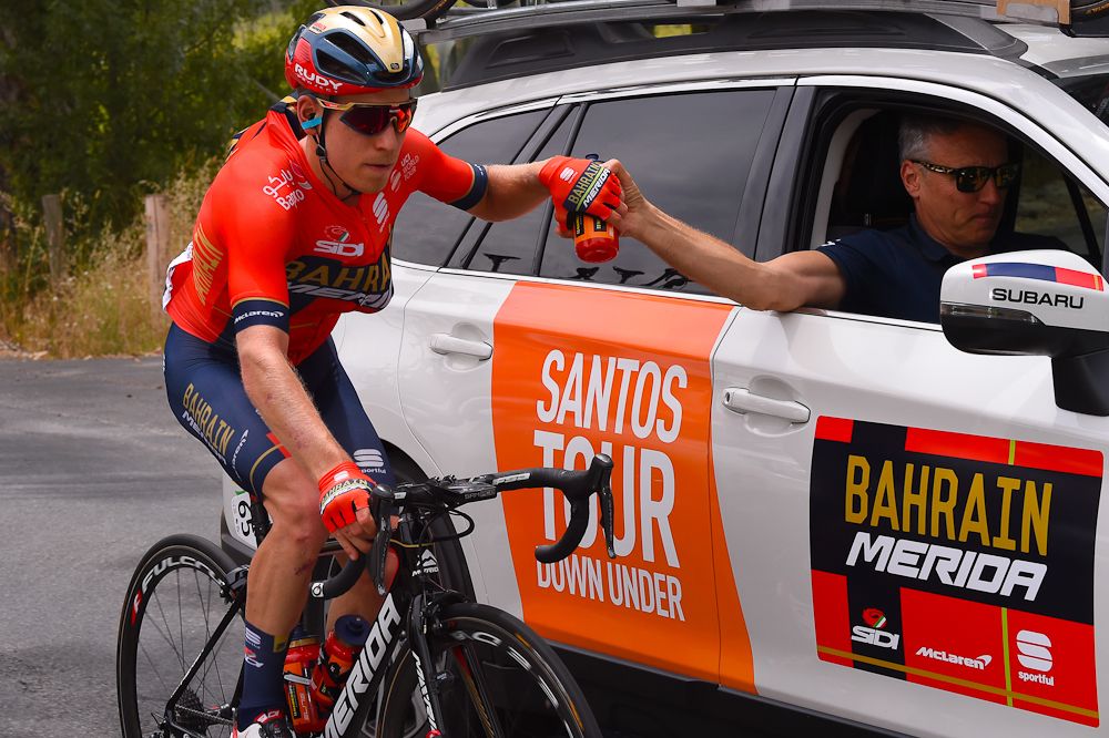 Hermann Pernsteiner (Bahrain Merida) loads up with bottles at the tour Down Under