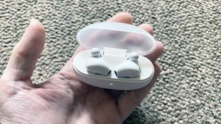 the oppo enco air wireless earbuds in their charging case