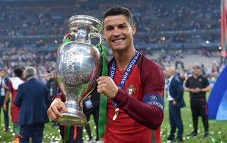 Cristiano Ronaldo celebrates with the Euro 2016 trophy after Portugal's win over France in the final in Paris.