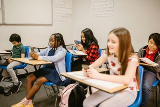 Students with cellphones in class