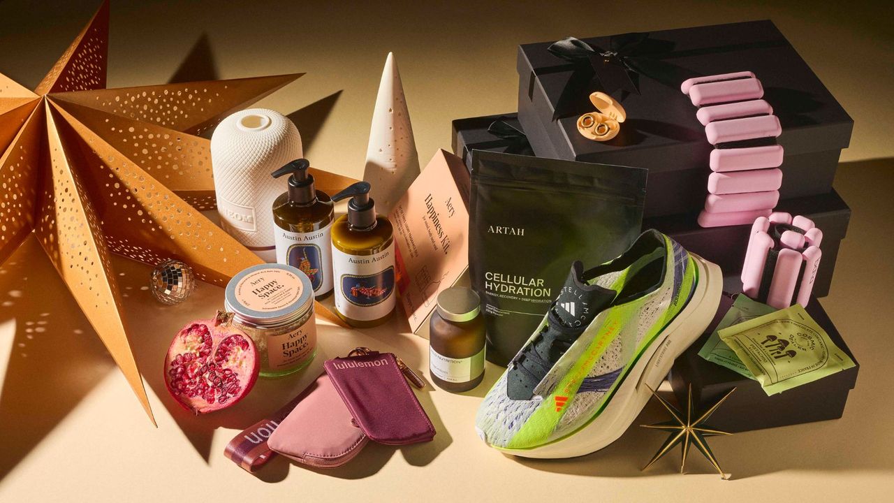 A flat lay shot of the best self care gifts, including Stella McCartney x adidas trainers, Bala bangles, Aery bath salts and more