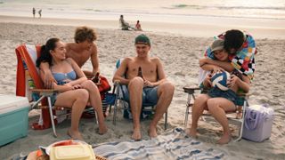 L-R: Belly (Lola Tung), Jeremiah (Gavin Casalegno), Conrad (Christopher Briney), Steven (Sean Kaufman) and Taylor (Rain Spencer) at the beach in "The Summer I Turned Pretty" season 3 on Prime Video