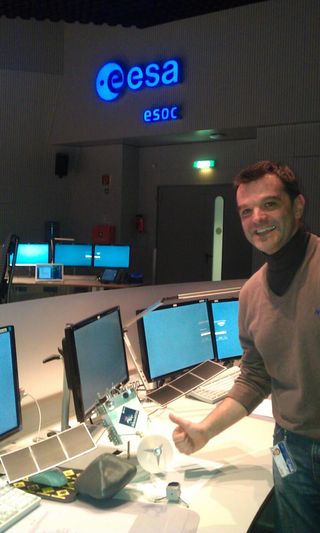Andrea Accomazzo, Rosetta spacecraft operations manager for the European Space Agency, poses with a model of the comet-chasing probe at ESA's Space Operations Center in Darmstadt, Germany on Jan. 20, 2014 as Rosetta woke up from 31 months of hibernation.