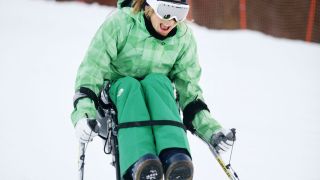 Woman wheelchair skiing