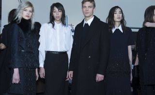 4 Models wearing variations of black and navy formal attire