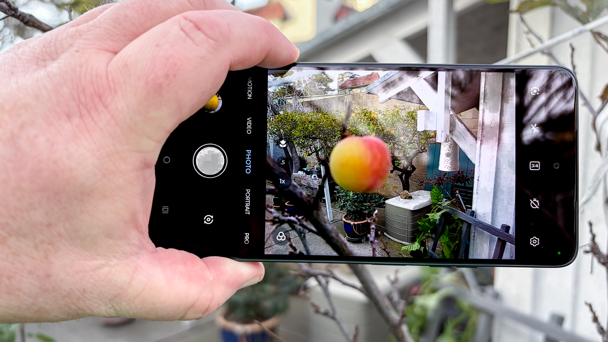 Moto G Power 2026 in hand taking photo