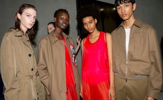 Neil Barrett S/S 2019 - Models wear beige jackets, coats and buttoned jumpsuits