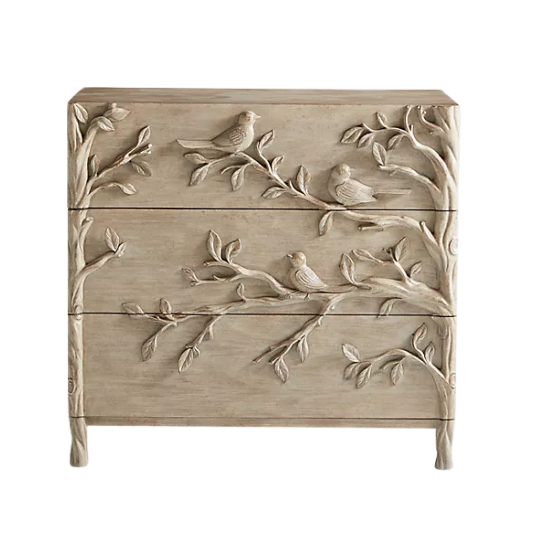 Anthropologie Ornithology Dresser against a navy wall,