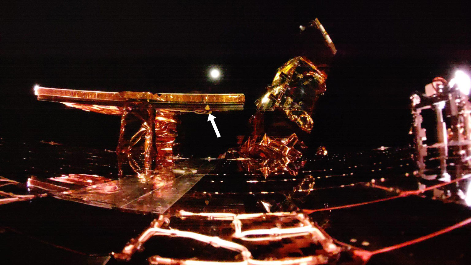 an image of small yellow rubber duck affixed to a lunar lander in space