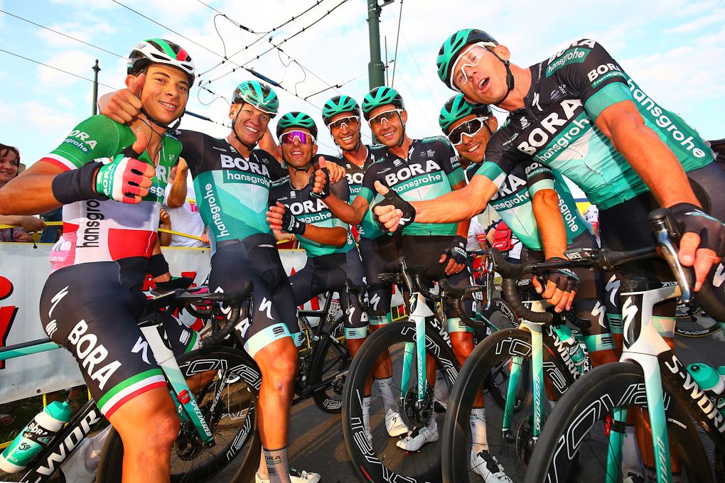 Pascal Ackermann and teammates celebrate winning stage 1 in Poland