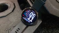 Garmin Venu 4 on barbell plates