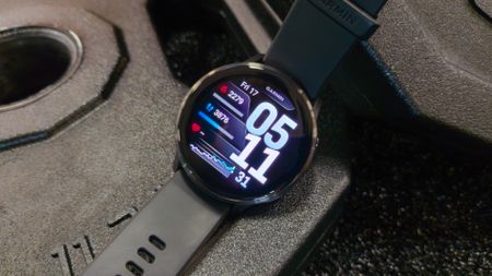 Garmin Venu 4 on barbell plates