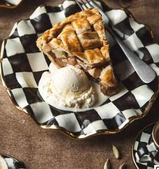 black and white checkerboard plate with pie and ice cream