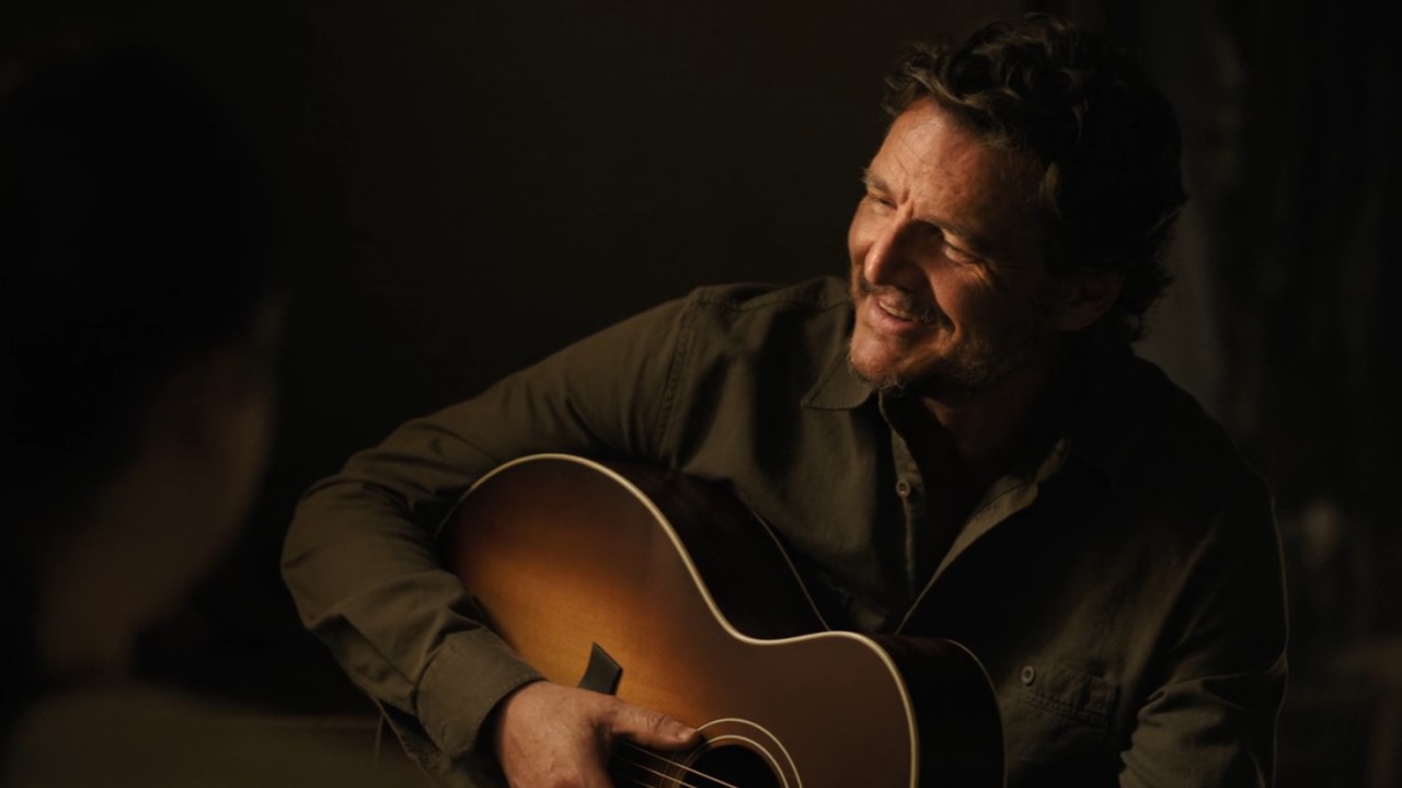 Pedro Pascal as Joel playing guitar on The Last of Us Season 2.